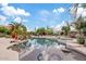 The backyard is an oasis with a beautiful pool, lush landscaping, and plenty of room for entertaining at 4055 N Recker Rd # 82, Mesa, AZ 85215