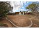 Large backyard featuring patio area, mature trees, and ample space for outdoor activities at 4117 W Sierra Vista Dr, Phoenix, AZ 85019