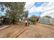 This backyard features ample space, scattered trees, and a useful outbuilding in the back corner at 4117 W Sierra Vista Dr, Phoenix, AZ 85019