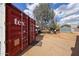 This expansive backyard features a shipping container, an outdoor cooking area, and ample space for activities at 4117 W Sierra Vista Dr, Phoenix, AZ 85019