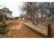 Backyard features a unique wooden deck built around a mature tree, providing a natural and rustic outdoor space at 4117 W Sierra Vista Dr, Phoenix, AZ 85019
