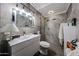 Bathroom with modern fixtures, tiled walls, and walk-in shower at 4117 W Sierra Vista Dr, Phoenix, AZ 85019