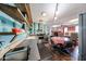 Kitchen has an open design with custom wood shelving and stainless steel appliances at 4117 W Sierra Vista Dr, Phoenix, AZ 85019