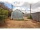 A backyard outbuilding, ideal for storage or a workshop, features a metal finish and a convenient door at 4117 W Sierra Vista Dr, Phoenix, AZ 85019