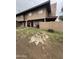 Inviting two-story home with a tidy lawn, colorful flowering bushes and covered patio area at 4219 N 69Th N Ln # 1319, Phoenix, AZ 85033