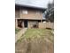 Charming two-story home with a tidy lawn, colorful flowering bushes and blue entry door at 4219 N 69Th N Ln # 1319, Phoenix, AZ 85033