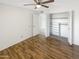 A bedroom featuring a ceiling fan, closet, and wood-look flooring, offering a blend of comfort and style at 4247 N 101St Ave, Phoenix, AZ 85037