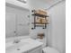 Cozy bathroom with industrial shelves, a white vanity, and a shower with curtain at 4559 E Sierrita Rd, San Tan Valley, AZ 85143