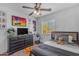 Well-lit bedroom with a neutral palette, a sports theme, and ample space for a game setup at 4559 E Sierrita Rd, San Tan Valley, AZ 85143