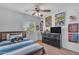 Comfortable bedroom with comic-themed decor, a window view, and a plush teddy bear on the bed at 4559 E Sierrita Rd, San Tan Valley, AZ 85143