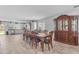 Dining room with a large wooden table and chairs in a light-filled open space at 4559 E Sierrita Rd, San Tan Valley, AZ 85143