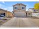 Charming two-story home featuring a spacious driveway and low-maintenance desert landscaping at 4559 E Sierrita Rd, San Tan Valley, AZ 85143