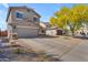 View of the home's facade, desert landscaping, and proximity to neighborhood street at 4559 E Sierrita Rd, San Tan Valley, AZ 85143
