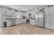 Bright, open kitchen with modern appliances and white cabinetry at 4559 E Sierrita Rd, San Tan Valley, AZ 85143