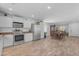 Spacious kitchen with stainless steel appliances and adjacent dining area at 4559 E Sierrita Rd, San Tan Valley, AZ 85143
