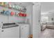 Well-organized laundry room with modern appliances and ample shelving for storage at 4559 E Sierrita Rd, San Tan Valley, AZ 85143