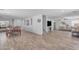 Open-concept living room with tile flooring, modern decor, and abundant natural light at 4559 E Sierrita Rd, San Tan Valley, AZ 85143