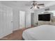 Spacious main bedroom with en-suite bathroom and walk-in closet access, featuring neutral décor at 4559 E Sierrita Rd, San Tan Valley, AZ 85143