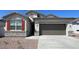 Charming single-story home featuring stone accents, desert landscaping and a two car garage at 4922 S 105Th Ln, Tolleson, AZ 85353