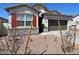 Charming single-story home featuring stone accents, desert landscaping and a two car garage at 4922 S 105Th Ln, Tolleson, AZ 85353