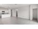 Open concept living space features white cabinets, stainless appliances and tile floors at 5004 S 105Th Ln, Tolleson, AZ 85353