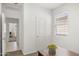 Functional home office with modern desk, window, and adjacent room at 5016 S 106Th Ln, Tolleson, AZ 85353