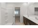 Bright bathroom with double vanity and shower at 5053 S 252Nd Ave, Buckeye, AZ 85326