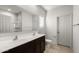 Bathroom featuring double sink vanity, and a toilet, offering functionality at 5053 S 252Nd Ave, Buckeye, AZ 85326