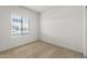 This cozy bedroom offers a bright window and neutral colored carpeting at 5053 S 252Nd Ave, Buckeye, AZ 85326