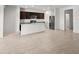 Open-concept kitchen with stainless steel appliances and granite countertops at 5053 S 252Nd Ave, Buckeye, AZ 85326