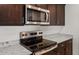 Close-up of kitchen appliances, including a stainless steel oven and microwave at 5053 S 252Nd Ave, Buckeye, AZ 85326