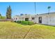 Expansive backyard featuring lush lawn, mature landscaping, and covered patio at 512 W Seldon Ln, Phoenix, AZ 85021