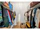 Walk-in closet with ample storage space and organized shelving for shoes, clothes, and accessories at 512 W Seldon Ln, Phoenix, AZ 85021
