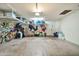 Well-lit garage with ample storage space and organization racks at 512 W Seldon Ln, Phoenix, AZ 85021