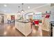 Open-concept kitchen with kitchen island and an arched doorway leading to the living room and dining room at 512 W Seldon Ln, Phoenix, AZ 85021