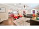 Spacious living room with a modern design, a large area rug, and an open layout to the kitchen and dining area at 512 W Seldon Ln, Phoenix, AZ 85021