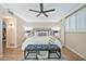 Beautiful main bedroom features a king bed, wood floors, ceiling fan, and neutral decor at 512 W Seldon Ln, Phoenix, AZ 85021