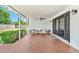 Inviting covered patio with tile flooring, ceiling fan, and comfortable seating area at 512 W Seldon Ln, Phoenix, AZ 85021