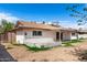 This backyard shot shows the property's dimensions plus a covered outdoor patio at 5203 W Acoma Dr, Glendale, AZ 85306