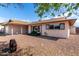 Front yard with desert landscaping and brick accents on the exterior elevation at 5203 W Acoma Dr, Glendale, AZ 85306