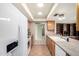 Bright kitchen with granite countertops, tile floors, and white appliances at 5203 W Acoma Dr, Glendale, AZ 85306