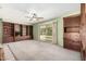 Spacious living room with built-in shelving and sliding glass doors to the backyard at 5203 W Acoma Dr, Glendale, AZ 85306