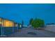 Backyard features a covered patio, mature tree, and a shed in a fenced in space at 5401 E Cicero St, Mesa, AZ 85205