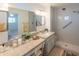 Tastefully renovated bathroom with double vanity, walk-in shower, and modern fixtures at 5401 E Cicero St, Mesa, AZ 85205
