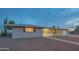Attractive single-story home with a well-manicured front yard and convenient attached garage at 5401 E Cicero St, Mesa, AZ 85205