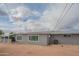 Single-story home shows a gray exterior and well-maintained landscape at 5401 E Cicero St, Mesa, AZ 85205