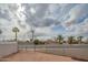 Gated yard with desert landscaping and mature palm trees in a residential neighborhood at 5401 E Cicero St, Mesa, AZ 85205