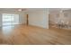 Spacious living room area featuring hardwood floors that leads to a dining area at 5401 E Cicero St, Mesa, AZ 85205
