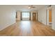 Spacious living room with hardwood floors, neutral walls, and a ceiling fan for added comfort at 5401 E Cicero St, Mesa, AZ 85205