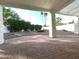 Covered patio with brick flooring, supported by columns, offering tranquil backyard views at 5564 N 77Th Pl, Scottsdale, AZ 85250